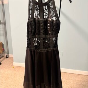 Elegant Bebe Black Lace Dress with leather detailing